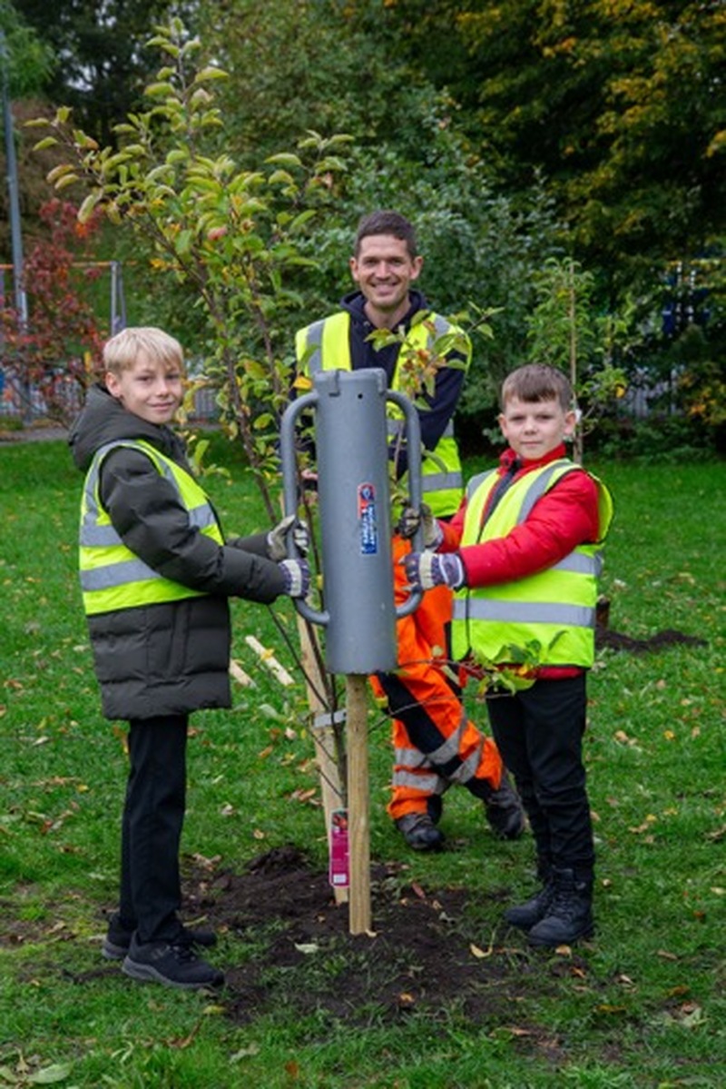 Other image for Pupils dig in to support special tree scheme